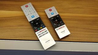 The premium L7 series TVs ship with a smaller alternative remote (right) as well as the larger remote that comes with the UL5A (left).