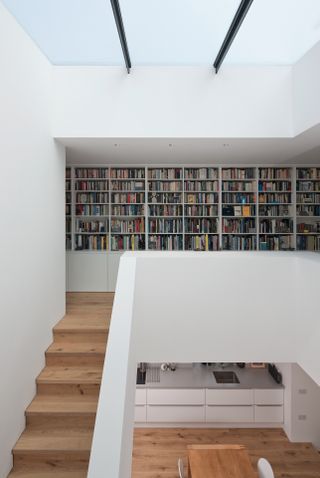 Double height staircase and book case