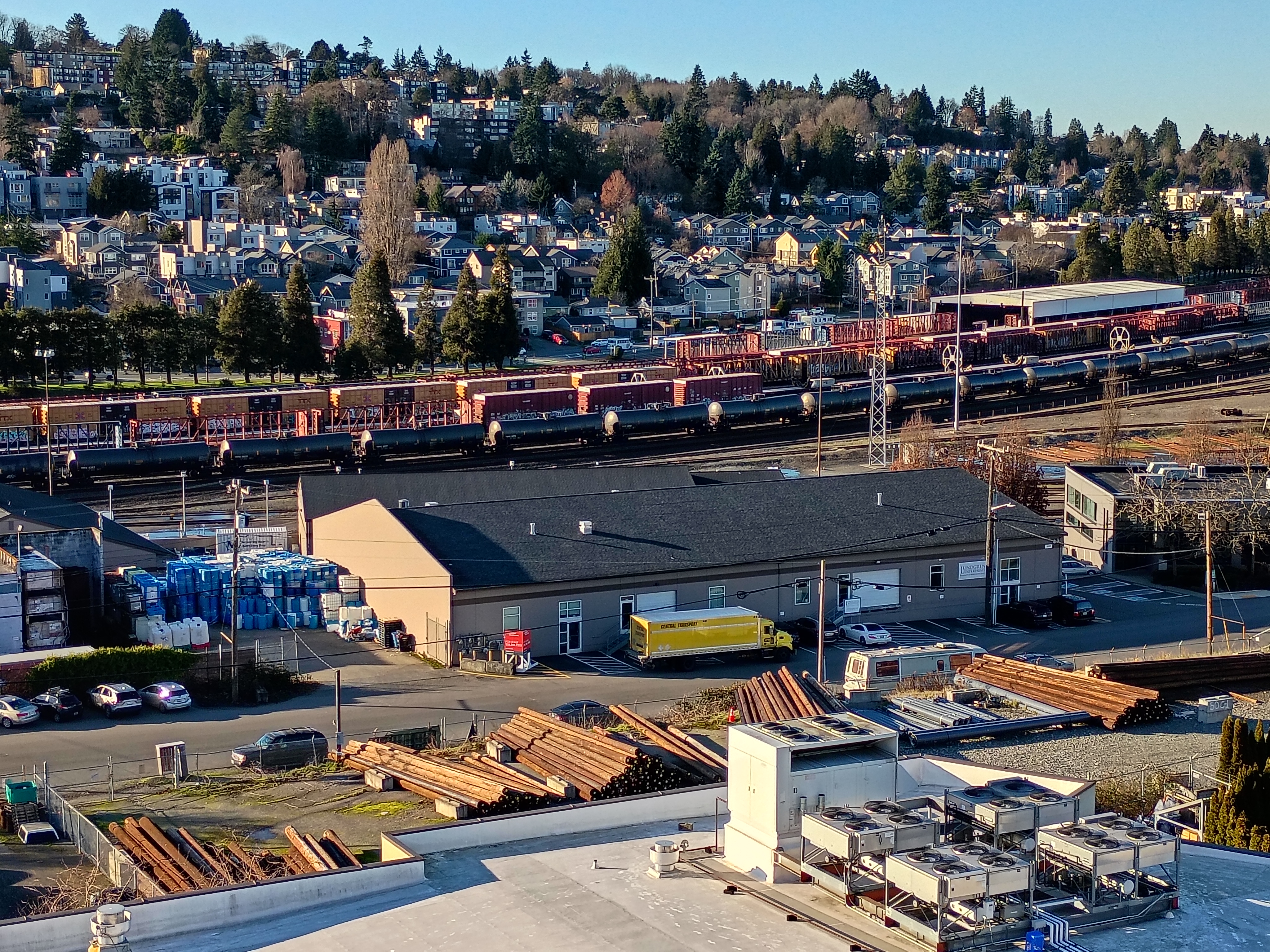 Trains next to a hillside