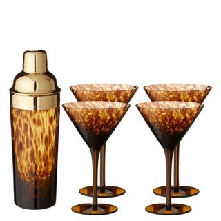 A five-piece tortoiseshell glass cocktail set with four martini glasses and a cocktail shaker is the best tortoiseshell homeware pieces.