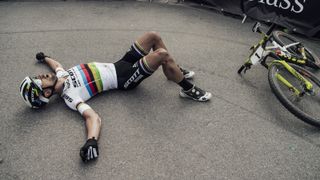 Schurter collapses in exhaustion after a hard race in Nove Mesto