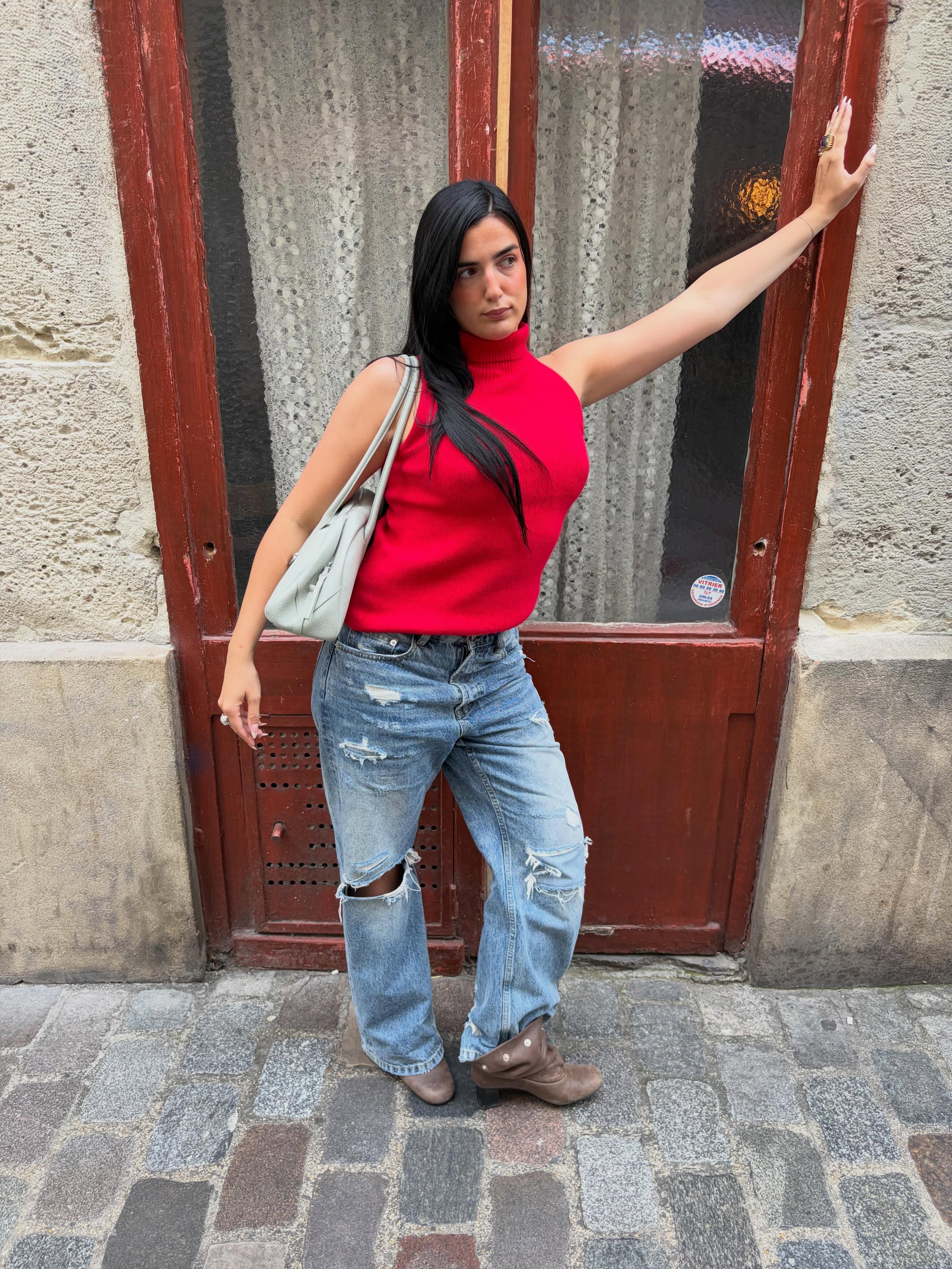 An image of a woman wearing summer to fall transitional denim outfit idea 2026