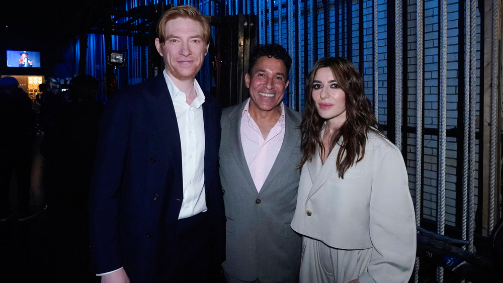 L-R: "The Paper" stars Domhnall Gleeson, Oscar Nunez and Sabrina Impacciatore pictured together at Radio City Music Hall during the 2025 NBCUniversal Upfront.