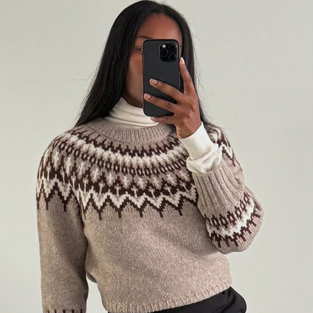 @nlmarilyn wearing a turtleneck sweater underneath a crewneck sweater.