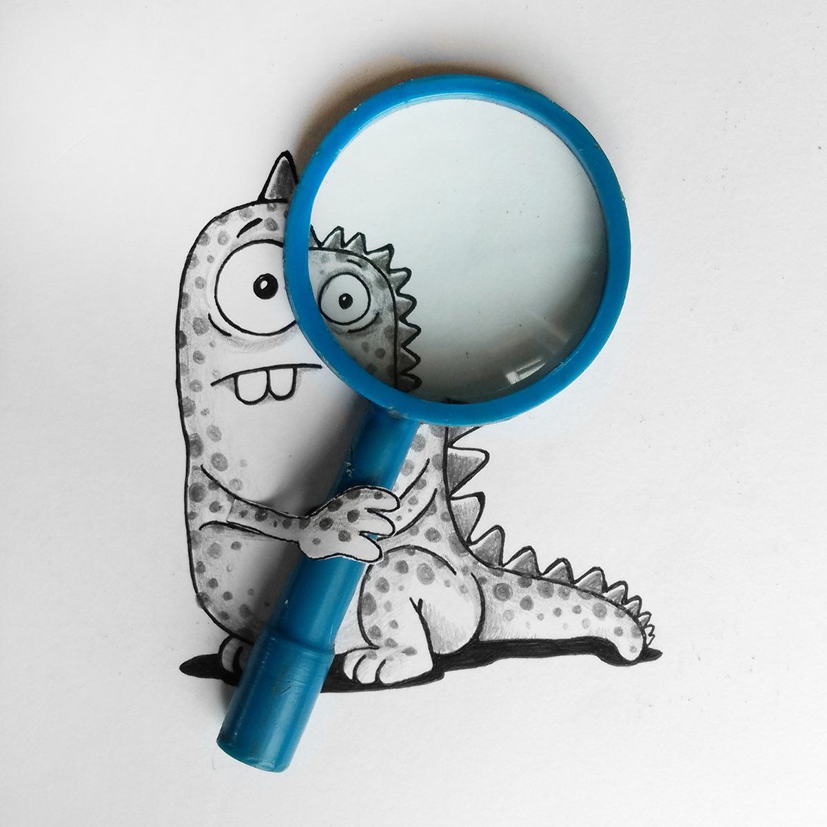 This doodle really comes to life with a paper arm that reaches off the page