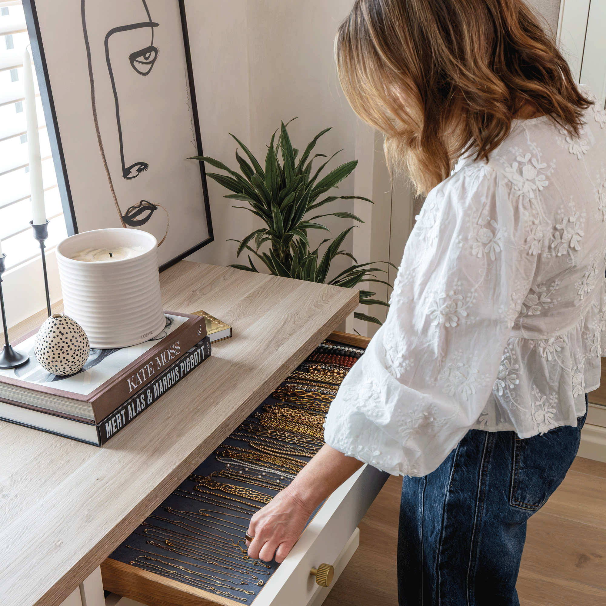 Rachel Stevens looking into the drawers of her dressing table