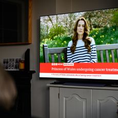 A relative of the Photographer watches television, as Catherine, The Princess of Wales announces that she is receiving a preventative course of chemotherapy for cancer on March 22, 2024 in London, England. 