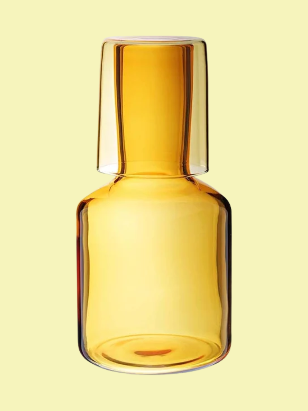A yellow water carafe and glass from Maison Balzac