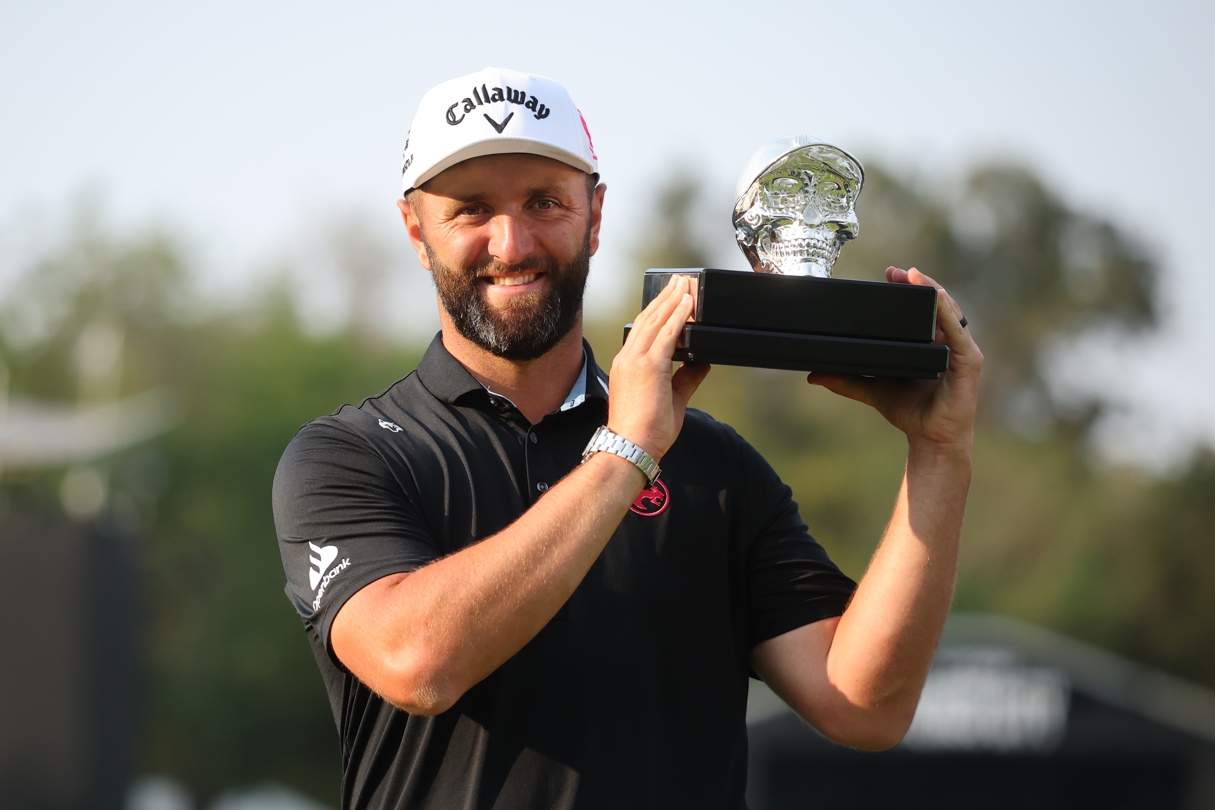 Jon Rahm holds up the LIV Golf Mexico City trophy following his win in 2026