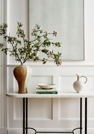 An entryway made to look luxurious with a well decorated console table