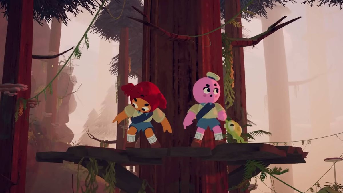 Two scouts stood on a platform around a Redwood tree in PEAK