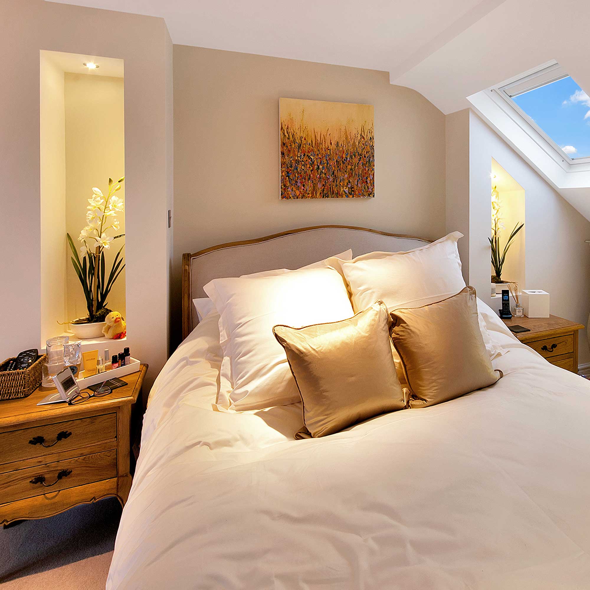 small loft conversion bedroom with backlit alcoves