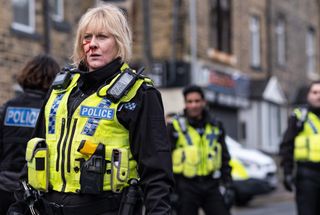 Sarah Lancashire as Catherine Cawood dressed in police uniform