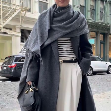 Jessica Habich Thomas wears a gray wrap coat in Soho New York City