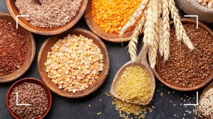 Ancient grains displayed in a variety of bowls from above