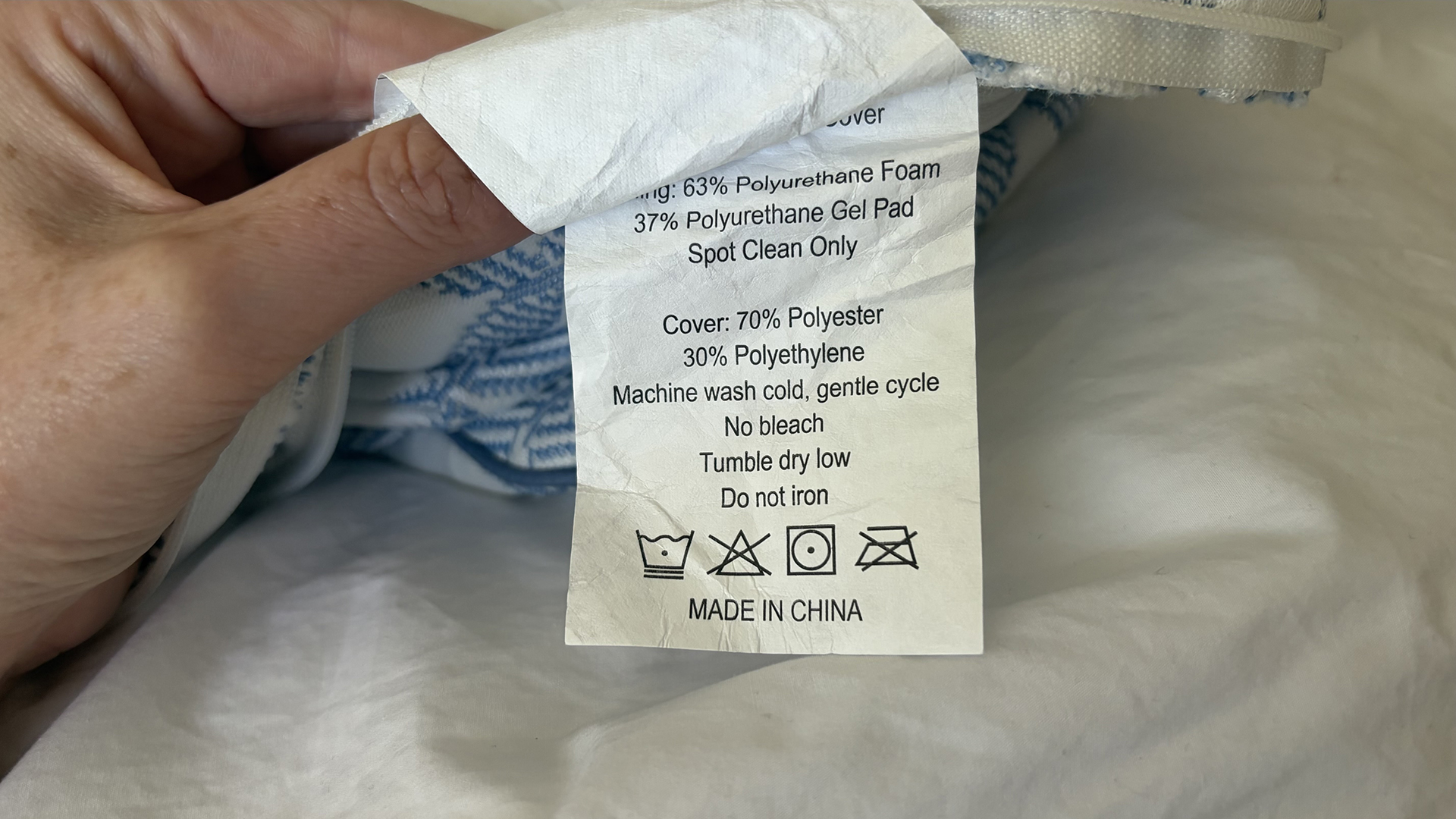 A close up of the care tag of the Helix Cooling Memory Foam Pillow