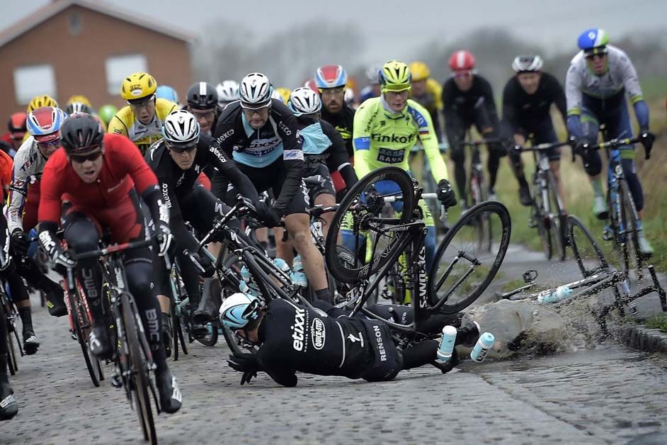 Lukasz Wisniowski takes a tumble during the windy Gent-Wevelgem