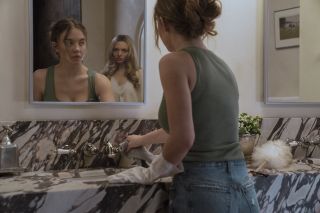 Sydney Sweeney standing at the mirror with Amanda Seyfried behind her in The Housemaid