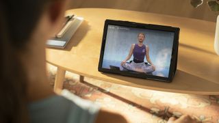 Peloton Digital review: A woman uses the Peloton Digital app to access a live yoga class