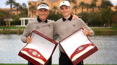 Bernard and Jason Langer with their belts after winning the PNC Championship