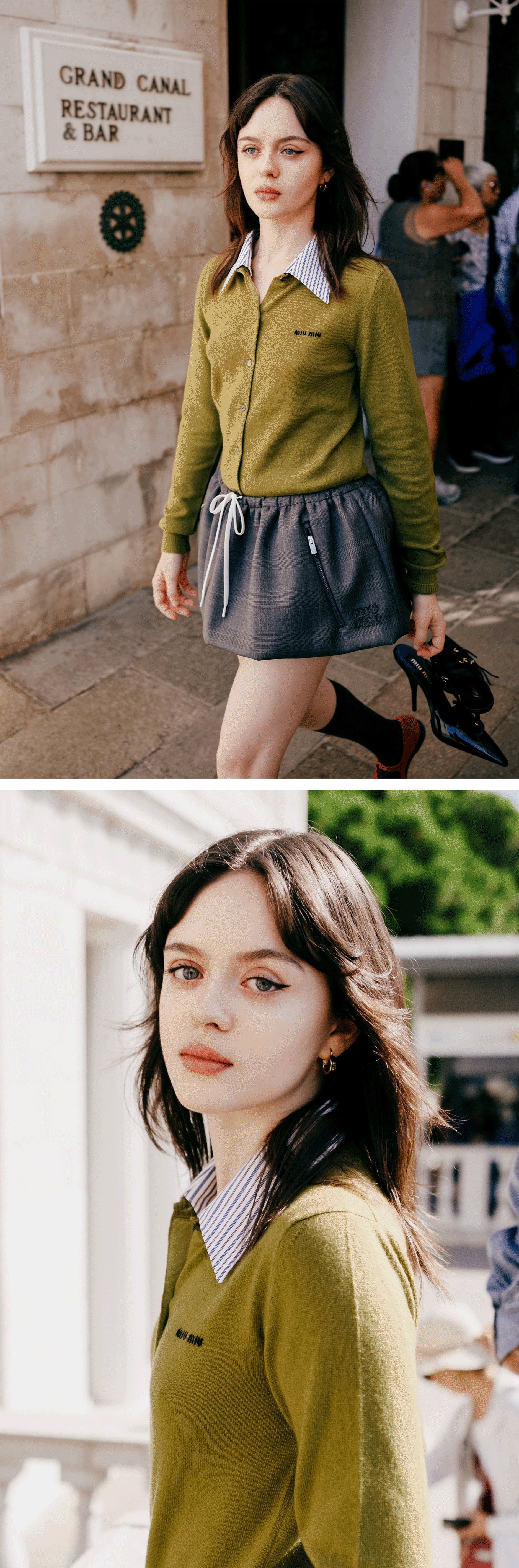 Viola Prettejohn arrives at The Testament of Ann Lee Venice photocall wearing an olive green cardigan and gray skirt with drawstring detailing by Miu Miu.