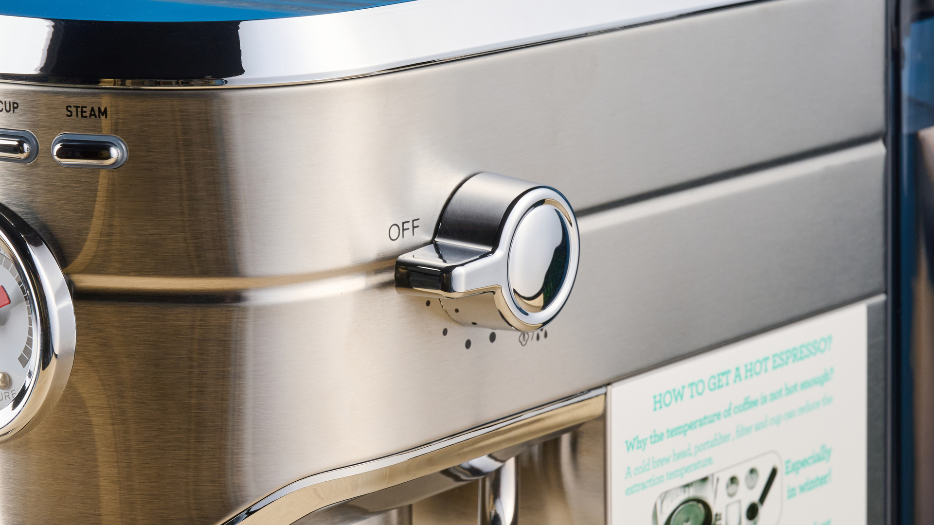 the casabrews cm5418 espresso machine in silver showing its steam wand and water tank and accessories