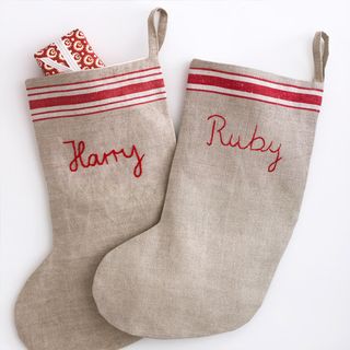 noel stocking with grey colour and stitched textiles