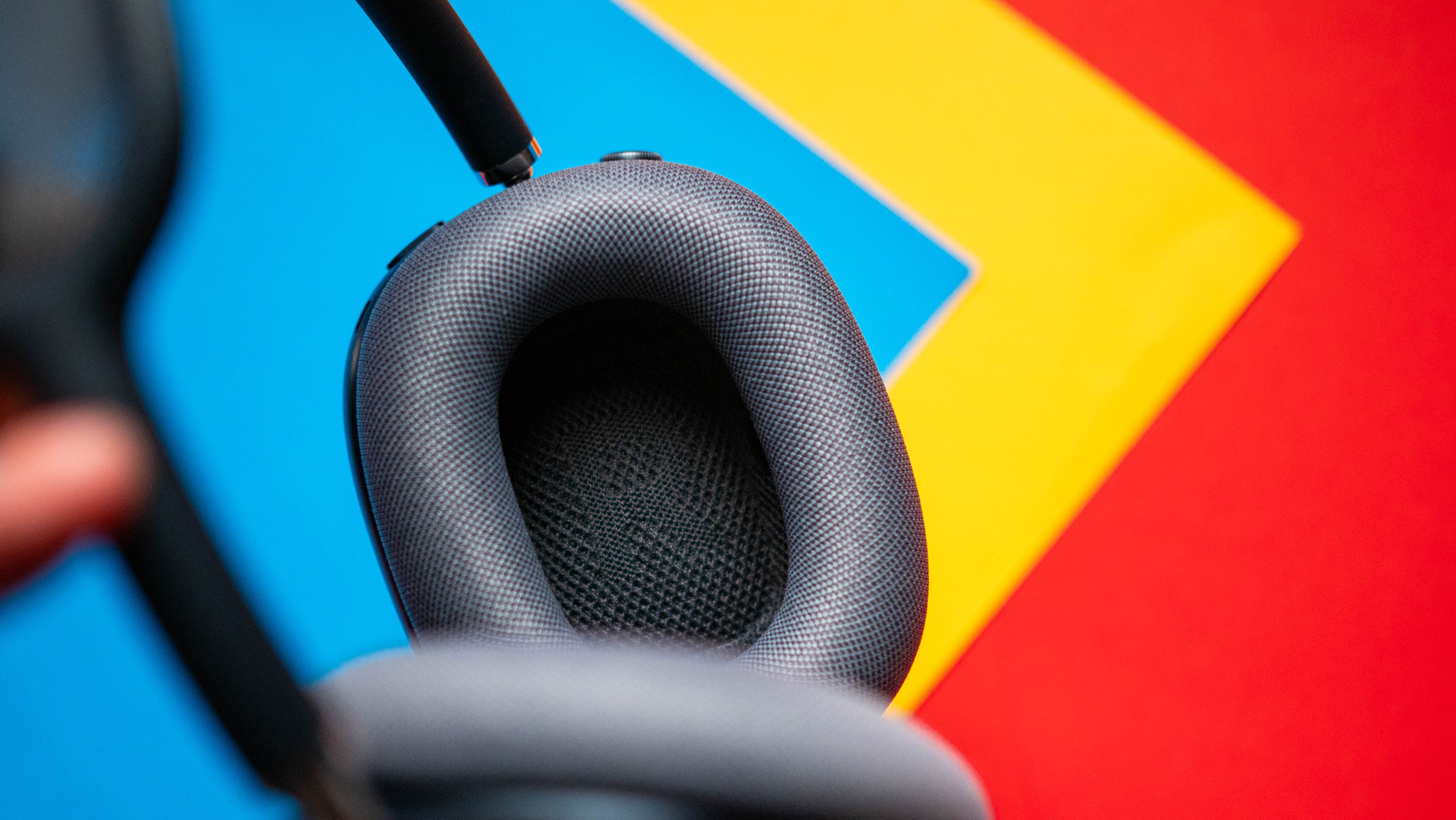 Apple AirPods Max 2 headset against a textured sheet showcasing the design