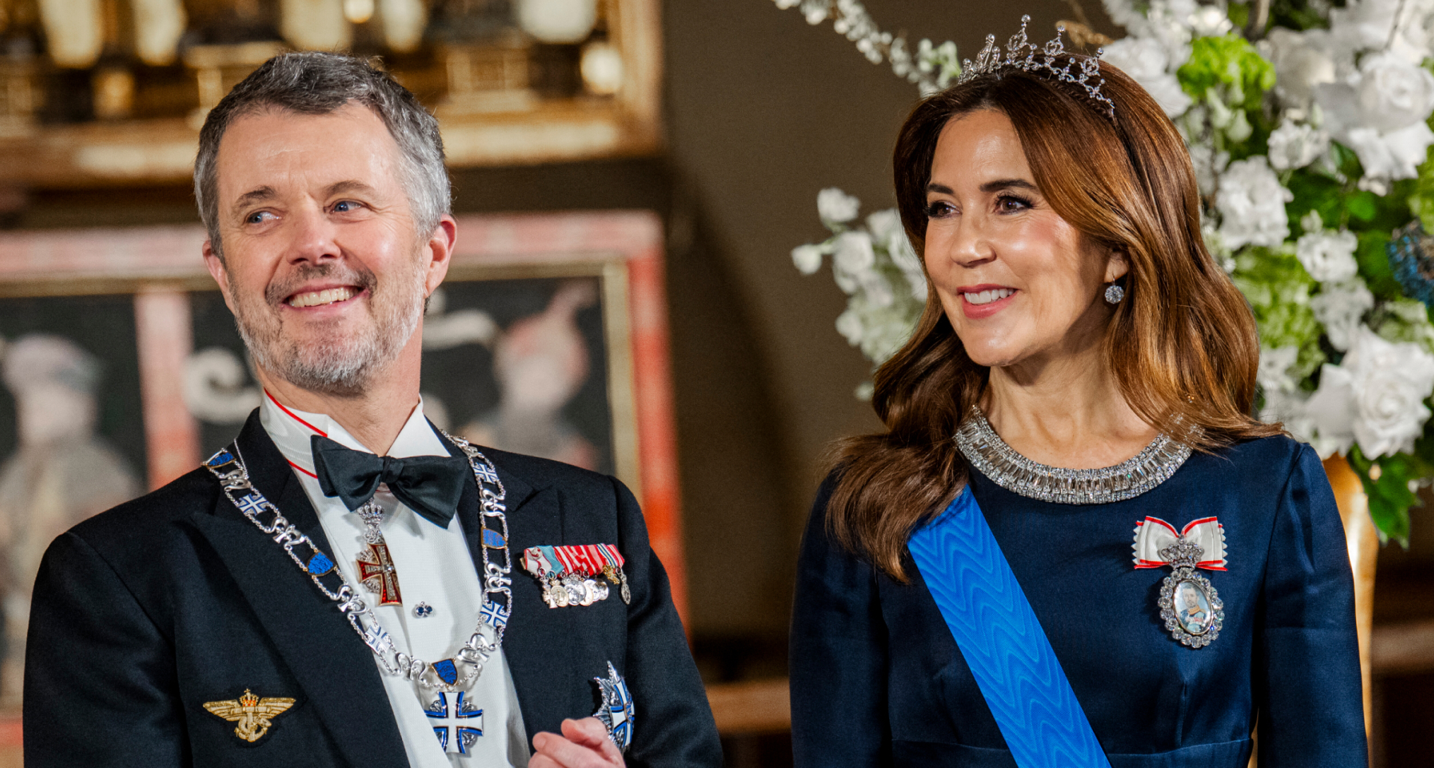 King Frederik and Queen Mary at a banquet, with Queen Mary wearing her wedding tiara and a blue gown