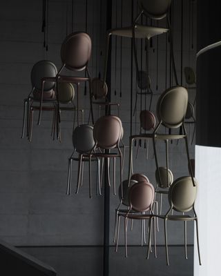 Dior chairs hanging from ceiling