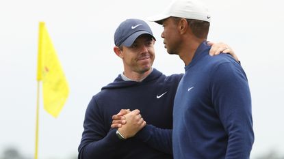 Rory McIlroy and Tiger Woods shake hands