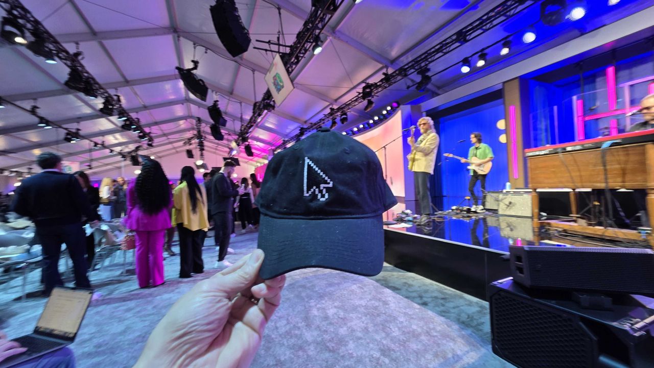 Swag celebrating Microsoft milestones and a presentation at the Microsoft 50th anniversary event