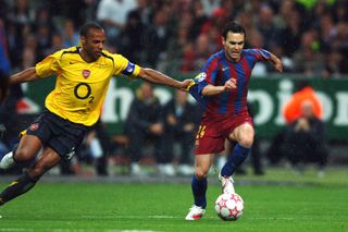 Andres Iniesta of Barcelona and Thierry Henry of Arsenal compete for the ball during the UEFA Champions League final match between Barcelona and Arsenal at the Stade de France on May 17, 2006 in Saint-Denis, France.