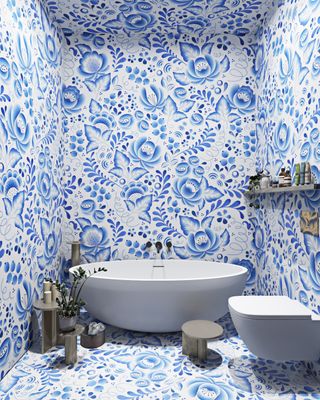 blue and white patterned wallpaper on the walls and ceiling of a modern bathroom