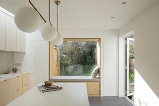 Contemporary kitchen by Studio 163 featuring ikea cabinets and Plykea doors with a HIMACS worktop