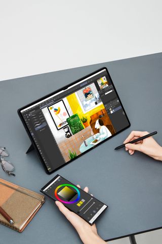 The Samsung Galaxy Tab S8 Ultra and Galaxy S22 Ultra, being used together to draw in Canva