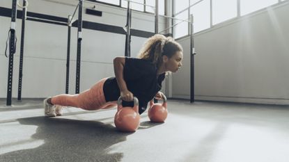 Woman does kettlebell workout