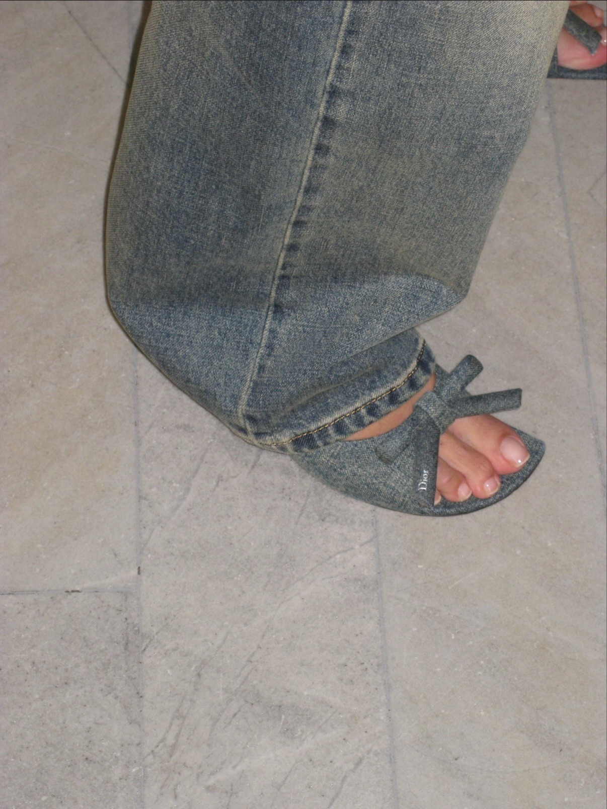 Alexa Chung wearing denim Dior shoes with a natural-looking French pedicure