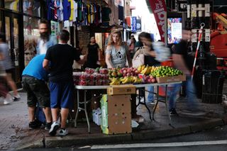 A street vendor sells fruit along Roosevelt Avenue in Queens, an area with a high number of recent immigrants on August 16, 2023 in New York City. The number of street vendors in New York City, many of them operating without a city license, has grown significantly in recent months following a surge of migrants to New York from Latin America and Africa. New York City Mayor Eric Adams has begun to crack down on the illegal vendors through tickets and confiscation of merchandise