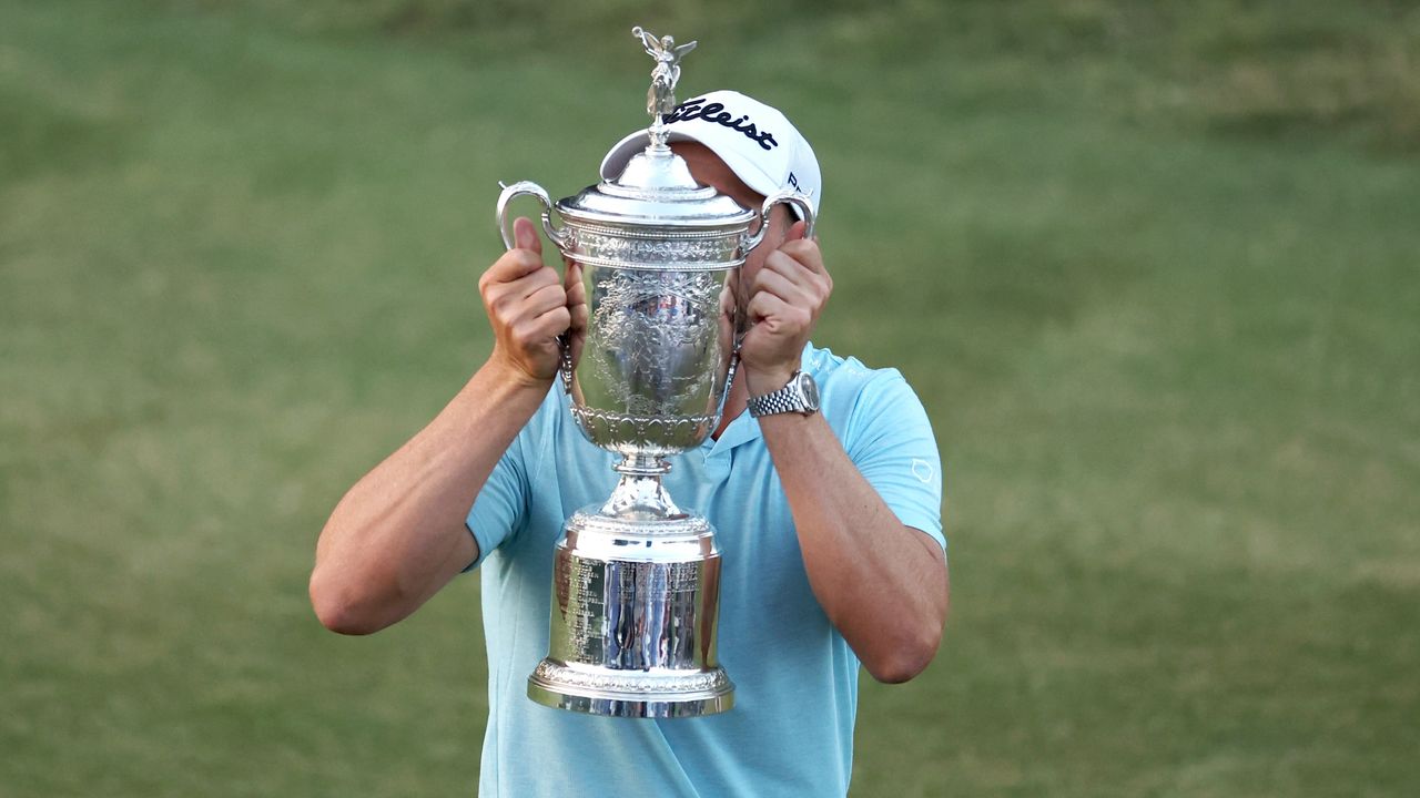 Wyndham Clark holds up the US Open trophy 