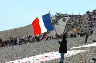 A fan flies the French flag on the slopes of Mont Ventoux