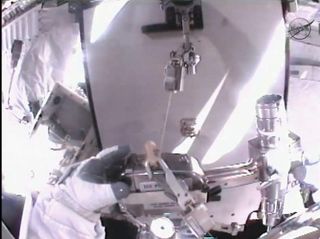 Akihiko Hoshide helmet view during spacewalk