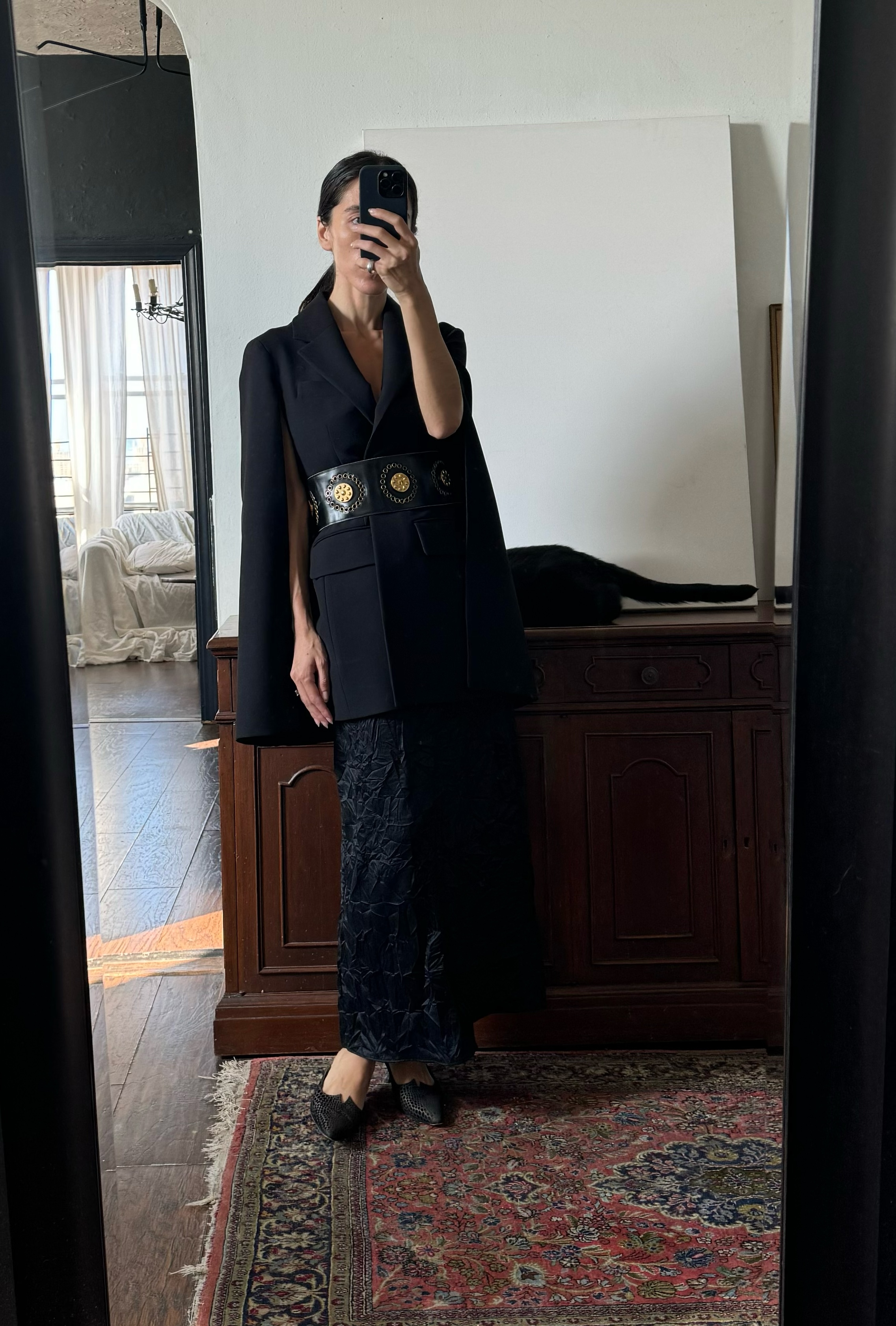 Alexis Badiyi wearing an evening jacket and a skirt