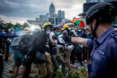 HONG KONG - DECEMBER 01:Pro-democracy protesters clash with police outside Hong Kong's Government complex on December 1, 2014 in Hong Kong. Leaders from the Federation of Students called on f