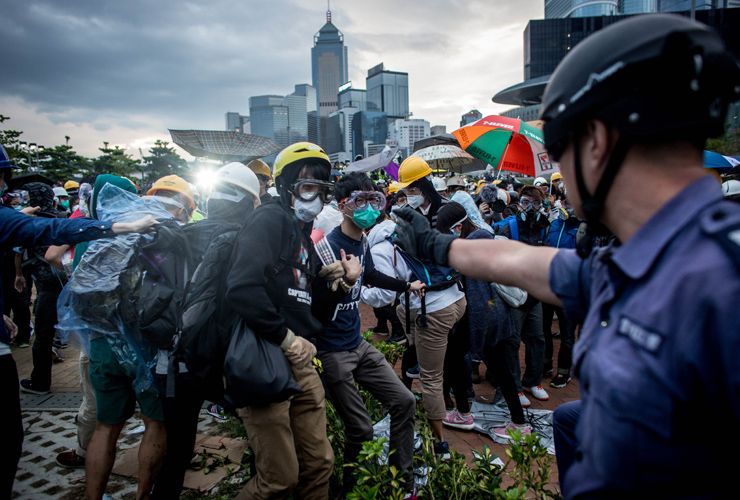 HONG KONG - DECEMBER 01:Pro-democracy protesters clash with police outside Hong Kong&amp;#039;s Government complex on December 1, 2014 in Hong Kong. Leaders from the Federation of Students called on f