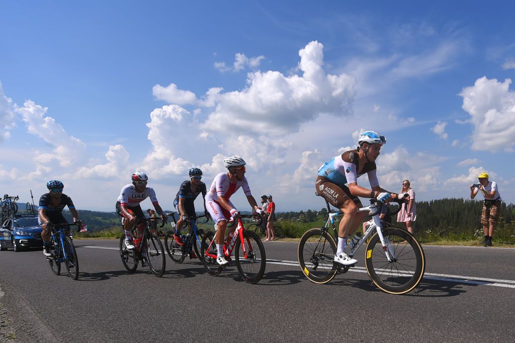KRAKOW POLAND AUGUST 09 Harry Tanfield of The United Kingdom and Team Ag2R La Mondiale Alan Banaszek of Poland and Team Poland Sam Brand of The United Kingdom and Team Novo Nordisk Juan Sebastian Molano Benavides of Colombia and UAE Team Emirates Peloton Fans Public during the 77th Tour of Poland 2020 Stage 5 a 188km stage from Zakopane to Krakow TourdePologne tdp20 on August 09 2020 in Krakow Poland Photo by Luc ClaessenGetty Images