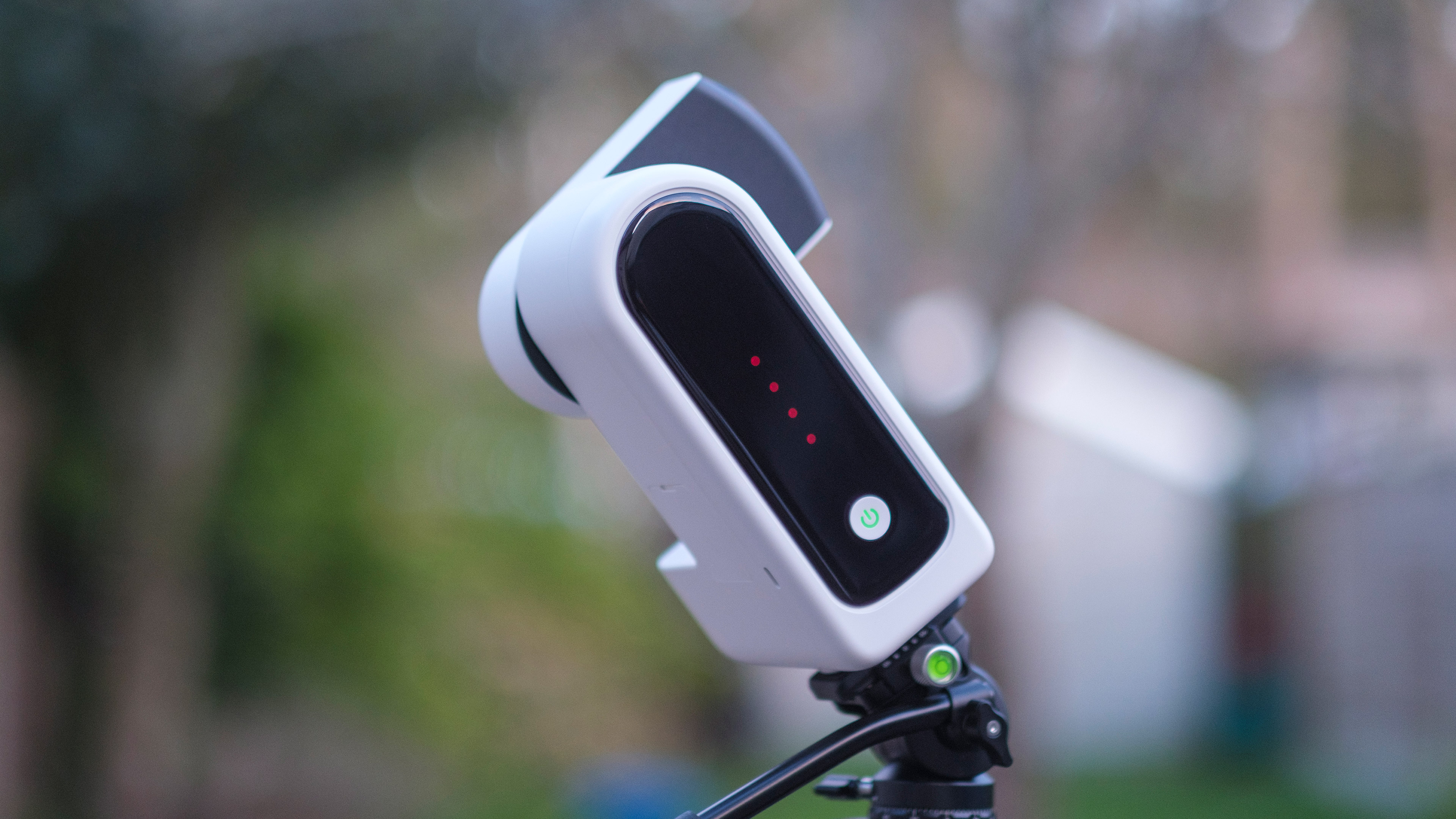 The ZWO Seestar S30 Pro showing its rear and buttons, with the arm open