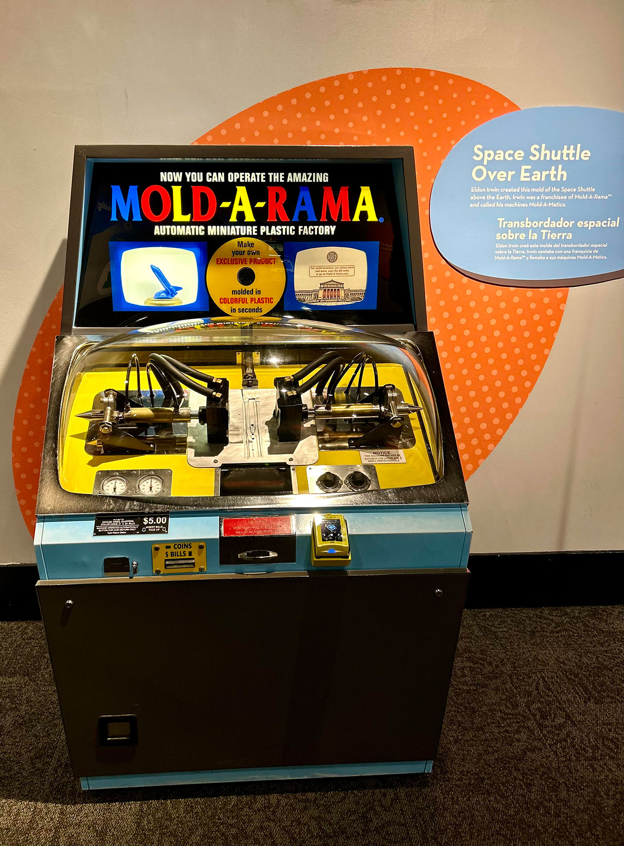 A Mold-A-Rama machine with the space shuttle over Earth mold is seen at the Museum of Science & Industry in Chicago as part of the exhibit, 