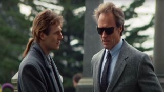 Liam Neeson chats with Clint Eastwood at a cemetery in The Dead Pool.