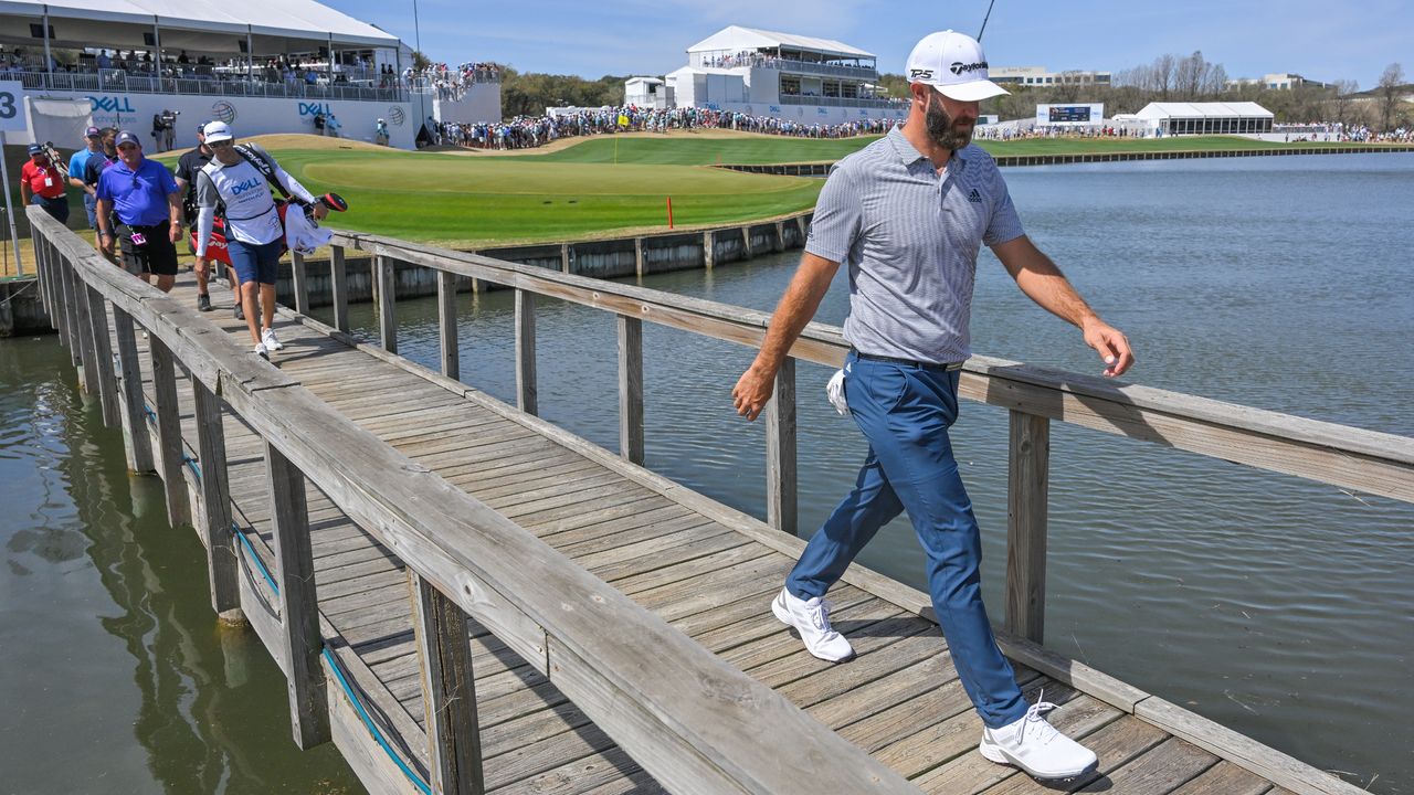 Dustin Johnson walks across the bridge towards the 14th tee box at the 2022 WGC-Match Play